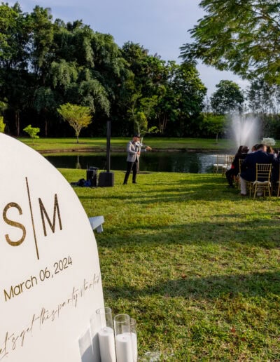 Elegant lakeside wedding with custom signage at Saint Patrick Palace.