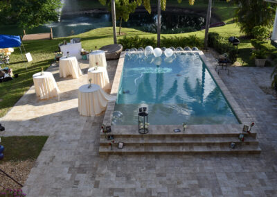 Elegant poolside cocktail hour with lake views at Saint Patrick Palace – perfect for weddings and events.