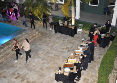Elegant poolside buffet catering with gourmet dishes at a luxury estate venue. Perfect for weddings and celebrations.