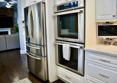 Saint Patrick Palace kitchen with stainless steel refrigerator and double ovens