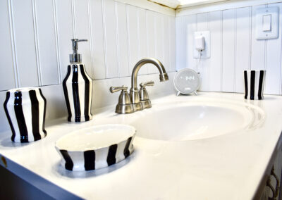 Elegant bathroom sink with black and white striped accents at Saint Patrick Palace