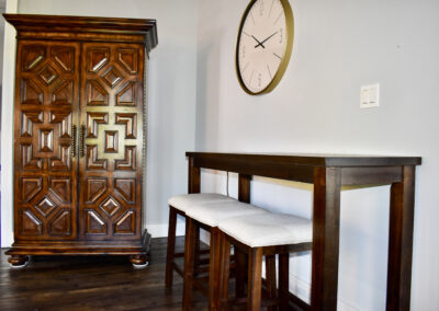 Vintage armoire and high-top seating area inside Saint Patrick Palace