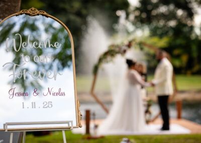 Elegant mirror welcome sign for Jessica & Nicolas’s outdoor wedding at Saint Patrick Palace.