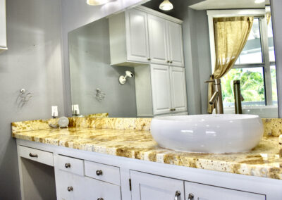 Granite vanity with vessel sink in Saint Patrick Palace bathroom