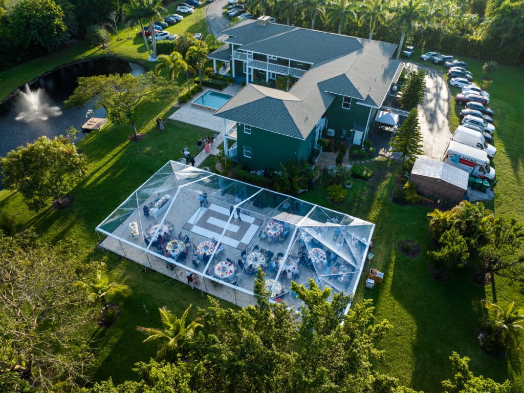 Saint Patrick Palace with clear tent reception and scenic pond views for luxury weddings.