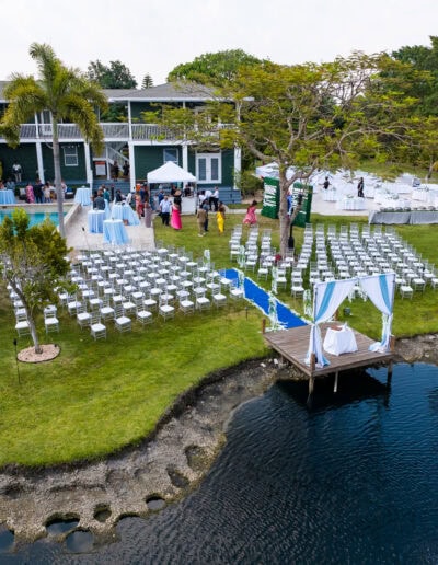 Celebrate your love with a stunning lakeside ceremony and reception at Saint Patrick Palace in Davie, Florida. This breathtaking venue features a romantic dockside altar, elegant seating for guests, and versatile outdoor spaces perfect for weddings, cocktail hours, and receptions. Experience a unique blend of natural beauty and sophisticated charm.