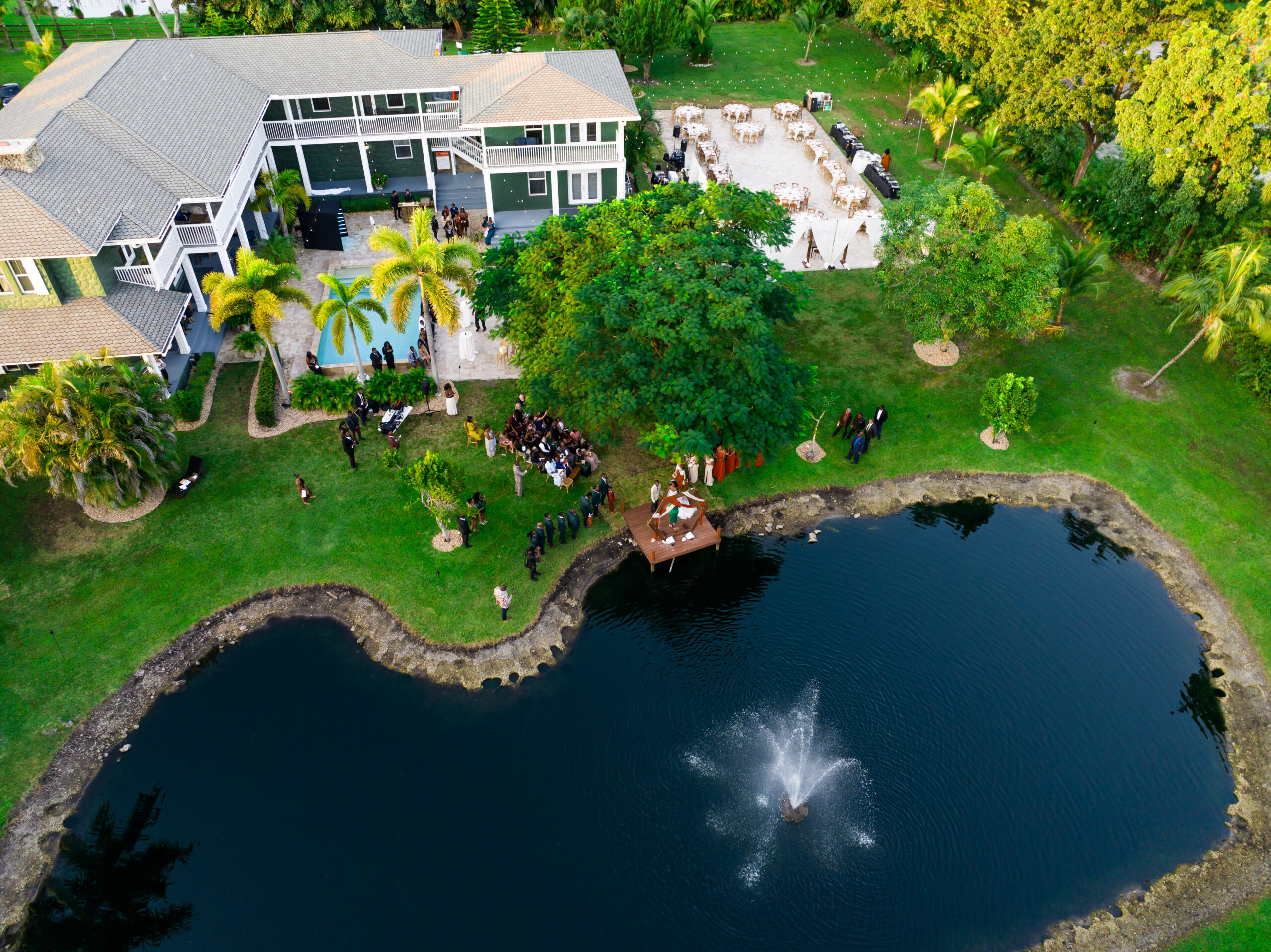 Aerial view of a stunning lakeside wedding at Saint Patrick Palace in Davie, FL.