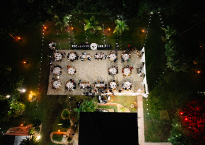 Romantic outdoor evening reception with elegant lighting and lush gardens at Saint Patrick Palace.