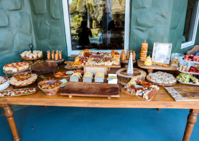 Stunning wedding & event buffet with artisan cheeses, fruits, meats, and gourmet appetizers.