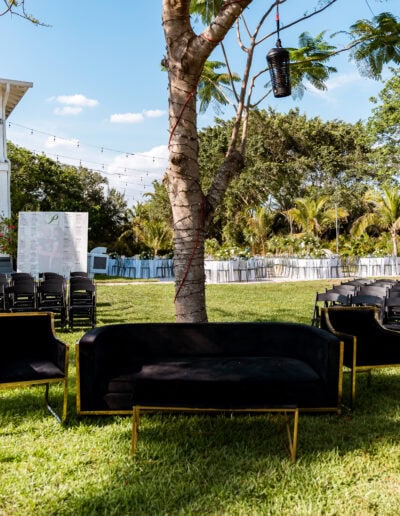 Modern outdoor wedding seating with chic lounge furniture and string lighting at Saint Patrick Palace.