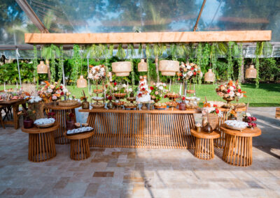 Rustic wedding dessert table with lush florals and decadent treats at Saint Patrick Palace.