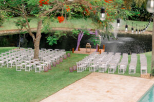 Lakeside wedding with purple draped arbor at a lush outdoor venue in Davie, FL – Saint Patrick Palace.