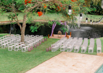 Lakeside wedding with purple draped arbor at a lush outdoor venue in Davie, FL – Saint Patrick Palace.
