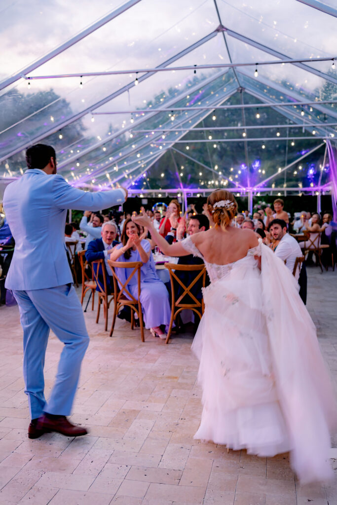 First dance under twinkling lights in a stunning clear tent at Saint Patrick Palace, Davie, FL.