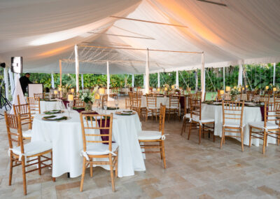 Elegant tented reception in South Florida with draping, lighting, and luxury details at Saint Patrick Palace.