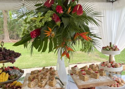 Elegant dessert display with tropical florals at Saint Patrick Palace events.