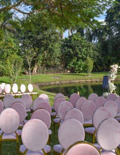 Blush and gold seating for a romantic lakeside wedding ceremony at Saint Patrick Palace.