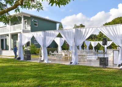Elegant outdoor wedding with draped canopies and stylish seating at Saint Patrick Palace.