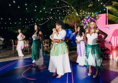 Hula dance performance under string lights—tropical, vibrant, and perfect for unforgettable celebrations.