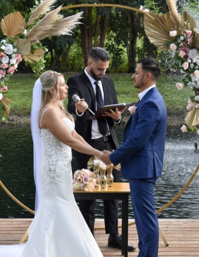 Romantic lakeside ceremony with pampas and blush florals at Saint Patrick Palace.