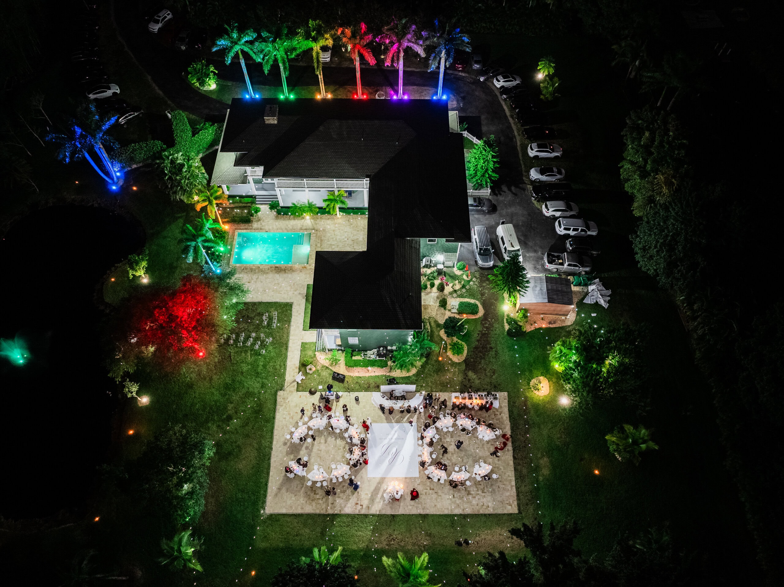 Aerial night view of private estate wedding reception with lighting at Saint Patrick Palace in South Florida