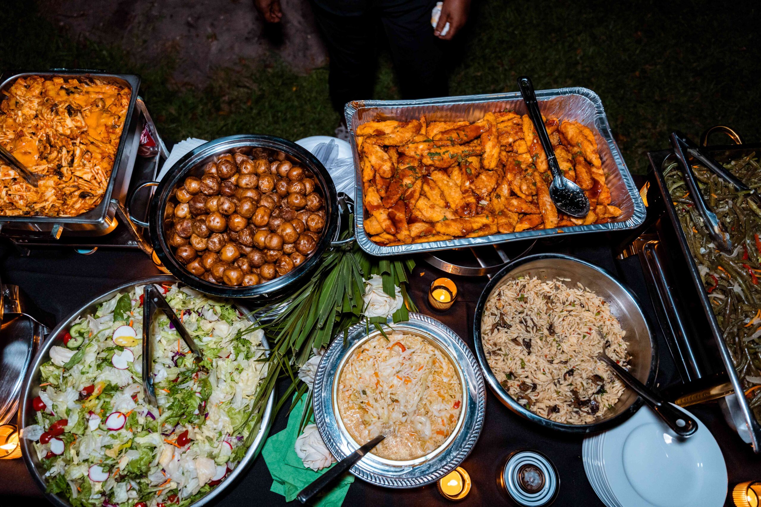 Buffet of cultural wedding dishes at South Florida Airbnb venue with open vendor policy.