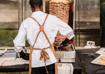 Chef serving fresh shawarma at South Florida Airbnb wedding with open vendor policy.