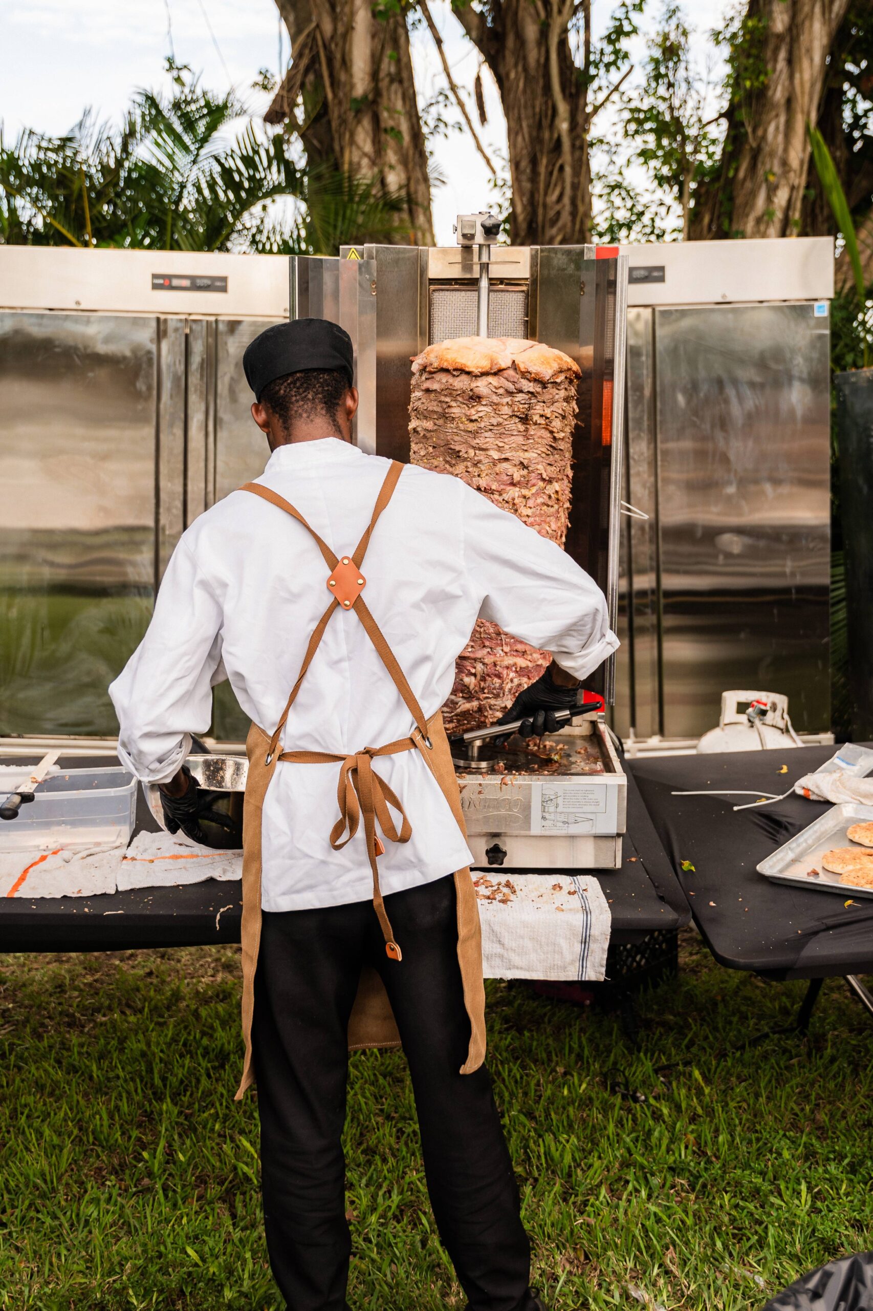 Chef serving fresh shawarma at South Florida Airbnb wedding with open vendor policy.