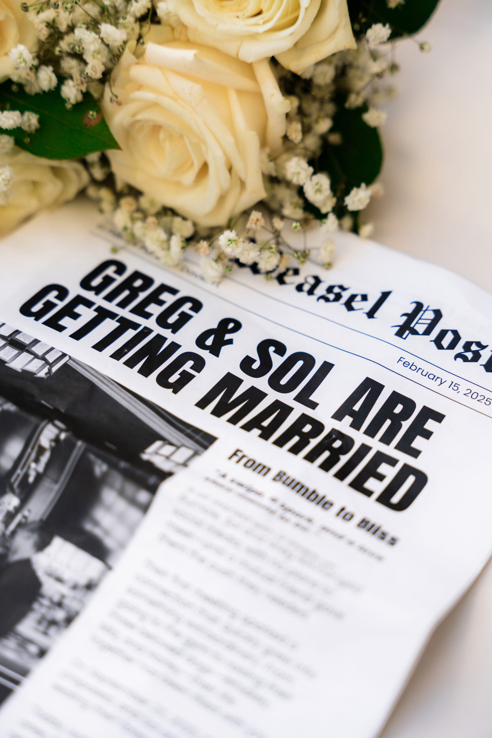 Custom wedding newspaper detail with roses at Airbnb wedding venue South Florida | Saint Patrick Palace.