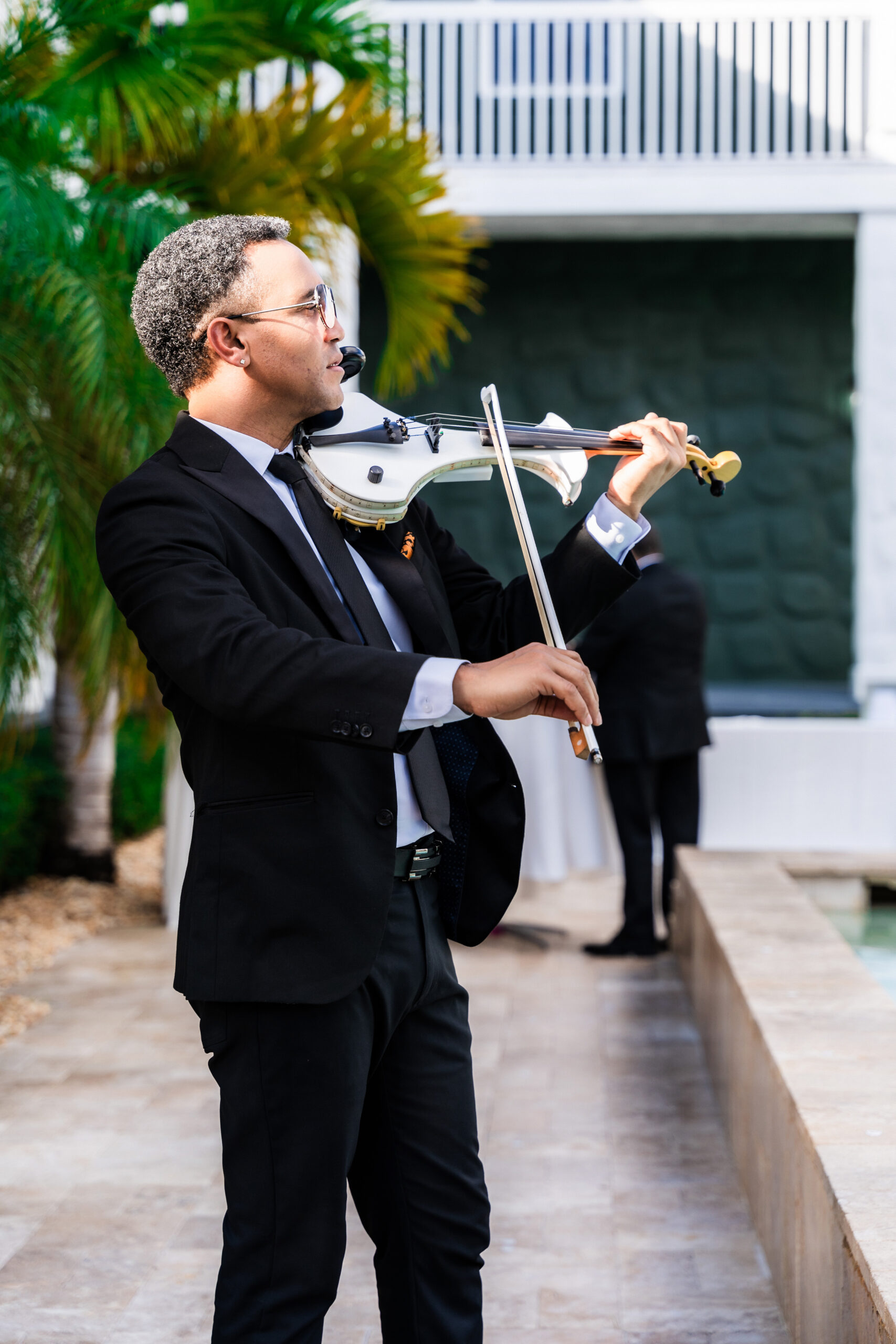 Violinist performing at luxury Airbnb wedding venue South Florida | Saint Patrick Palace.