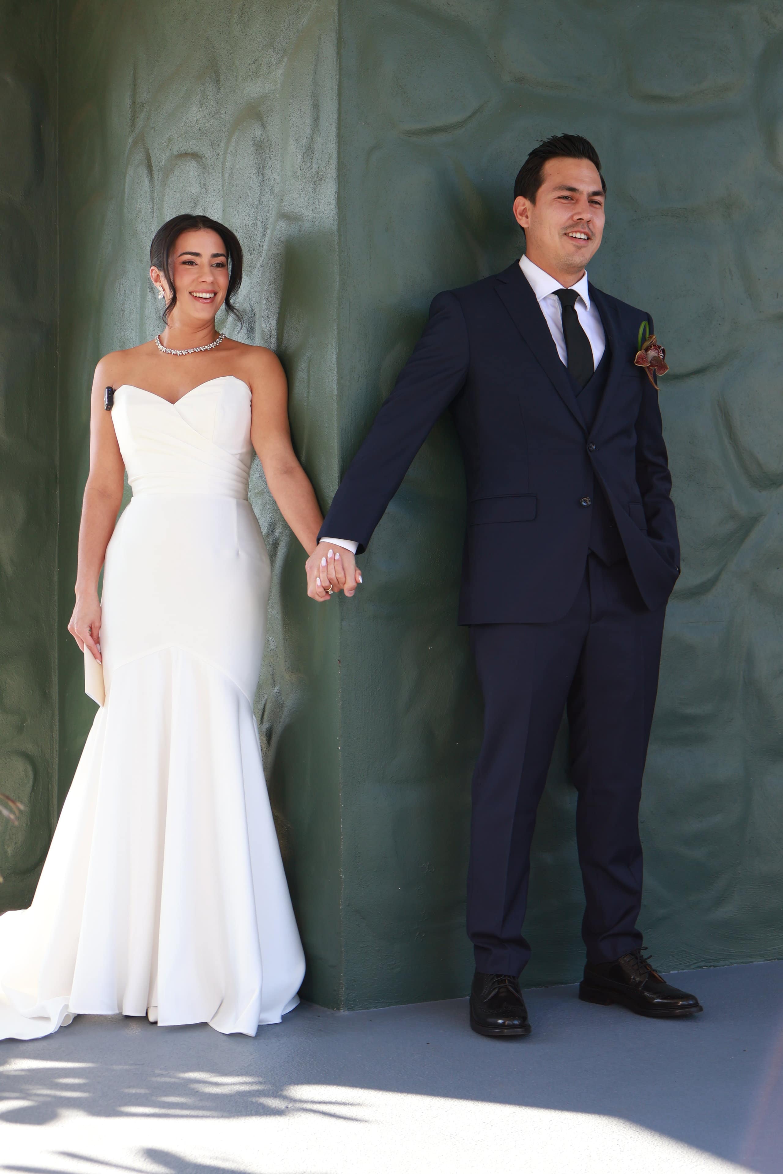 Bride and groom holding hands during a blind first look before their wedding ceremony at Saint Patrick Palace.