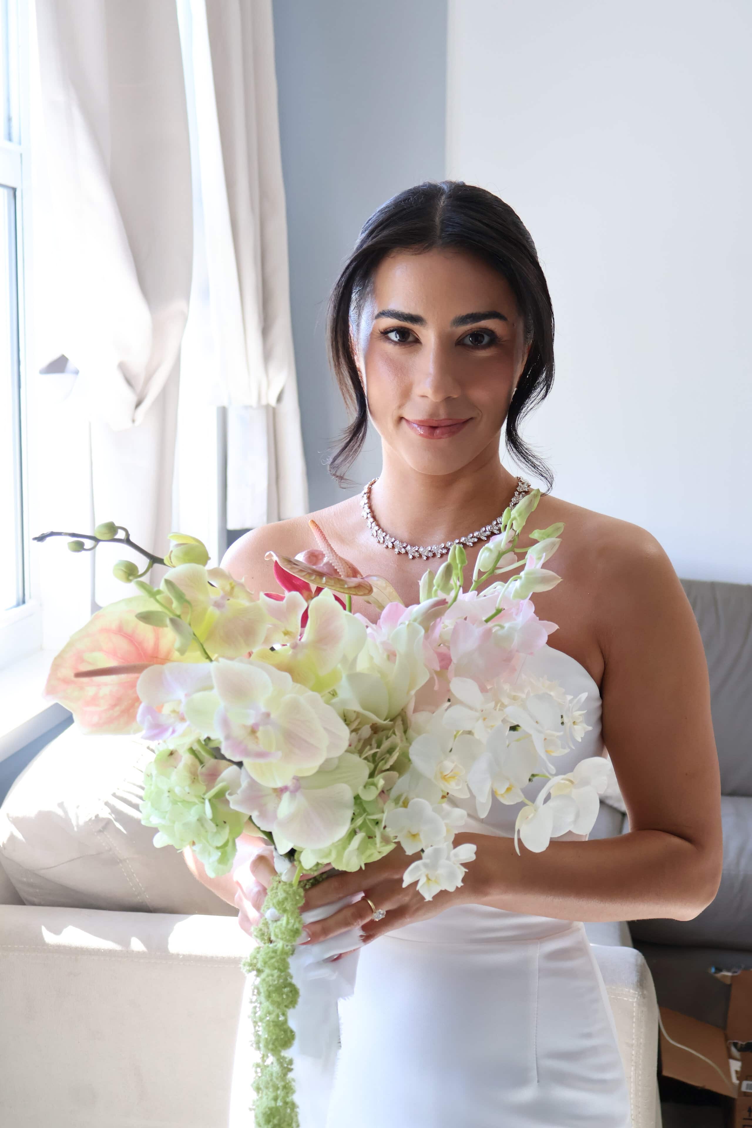 Bride holding bouquet during getting ready at Saint Patrick Palace South Florida wedding venue