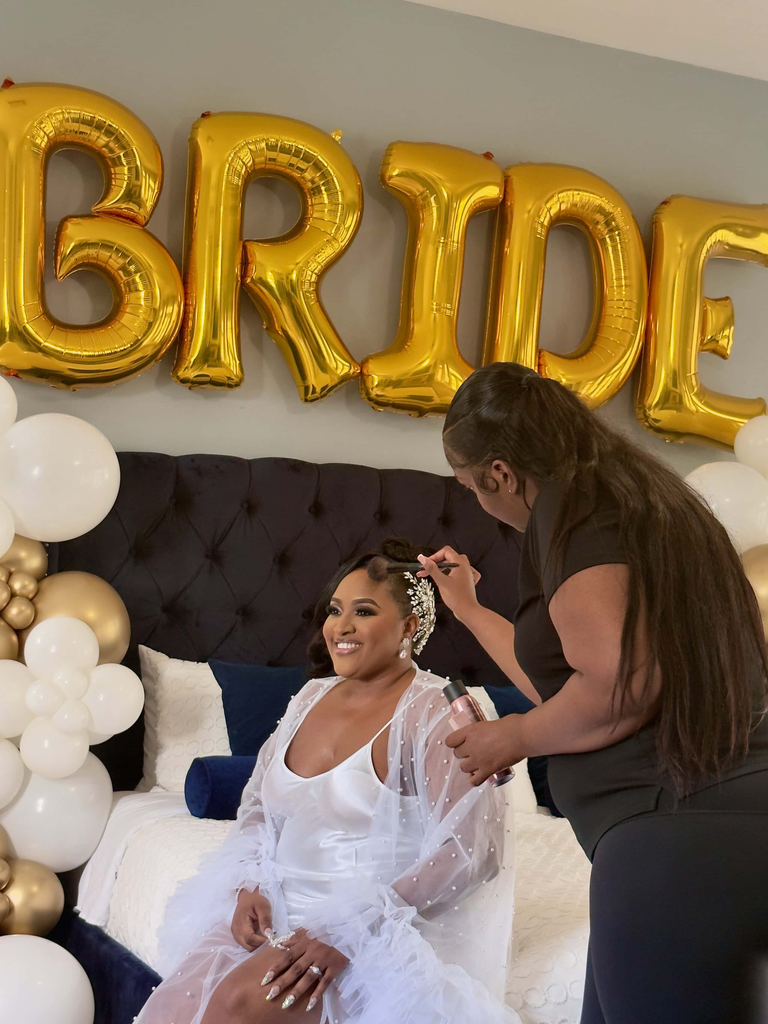 Bride getting ready with makeup artist before wedding ceremony at Saint Patrick Palace.