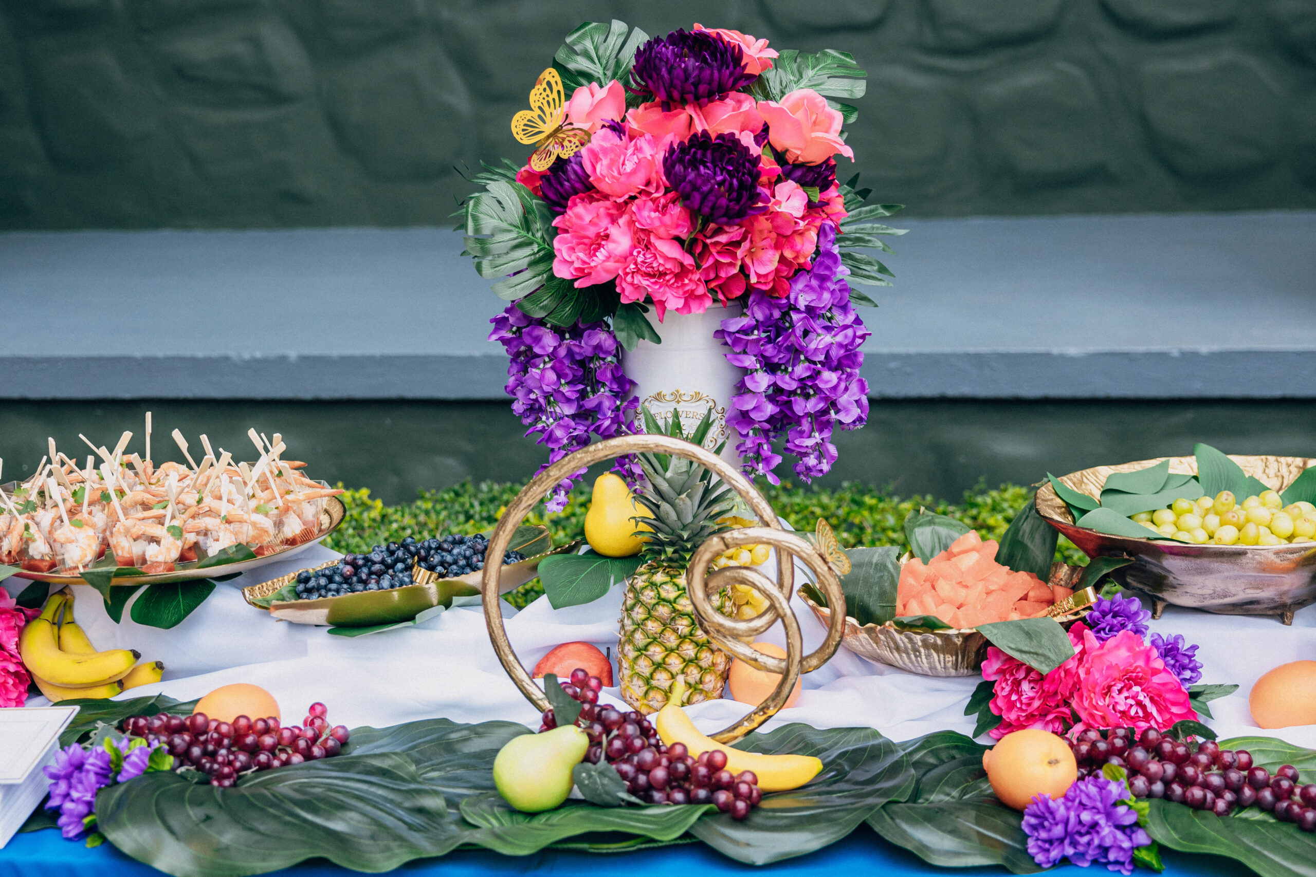 Caribbean-inspired food and floral display at a luxury 40th birthday party in Davie, FL.