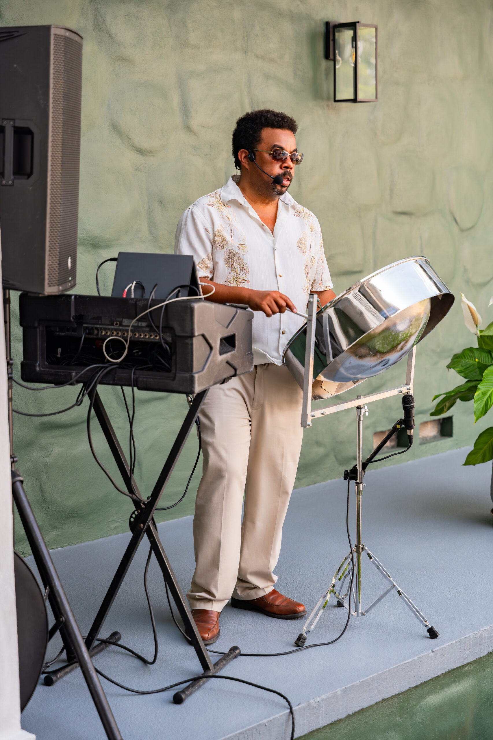 Steel drum musician performing at a Caribbean-inspired 50th birthday party in South Florida.