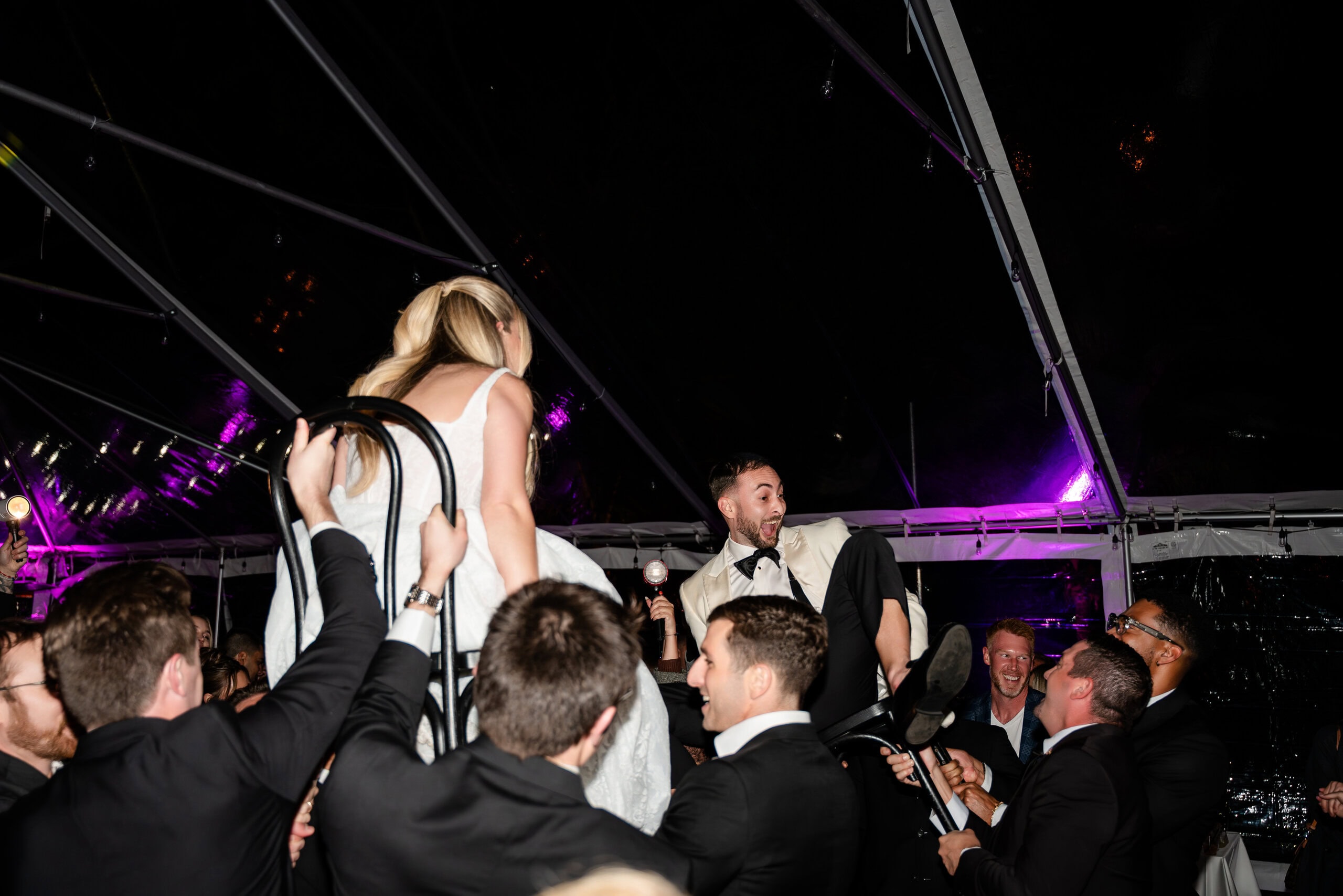 Wedding dance floor chair lift under clear-top tent at private estate venue in Davie Florida