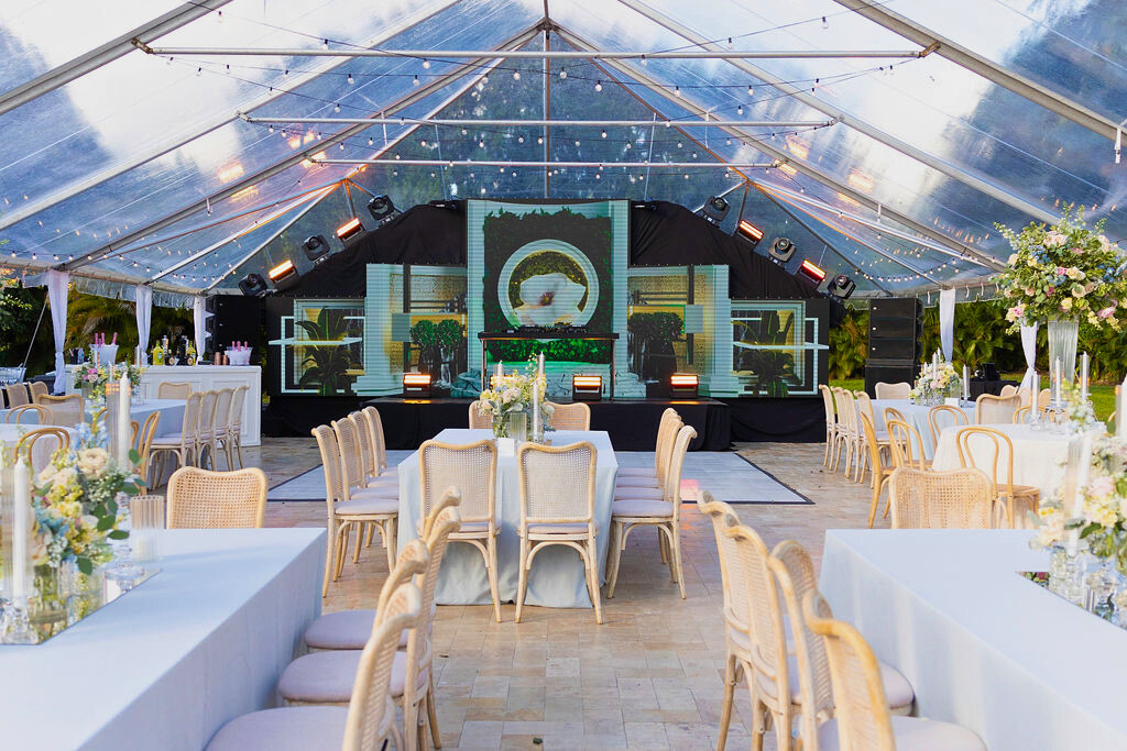 Luxury clear-top tented reception in South Florida with elegant décor, lighting, and upscale event design.