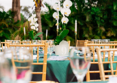 Orchid centerpiece on gold and green wedding table