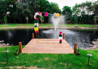 Ceremony arch with pond fountain backdrop