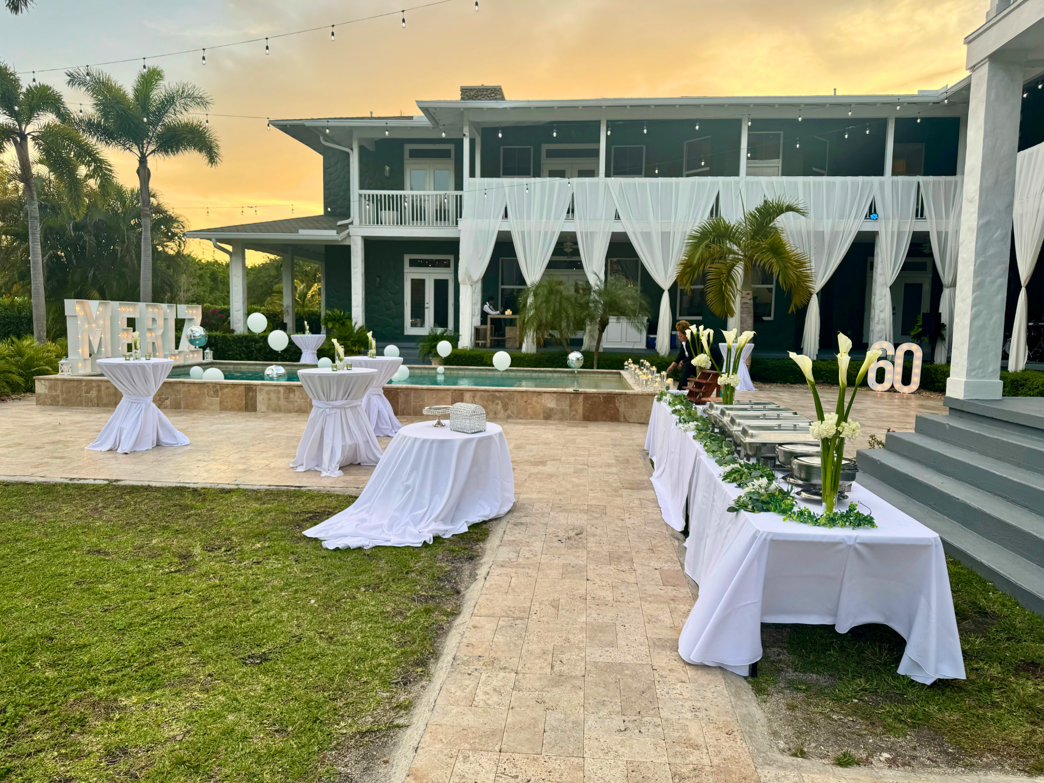 Elegant Poolside 60th Celebration at Saint Patrick Palace Elegant 60th birthday celebration setup at Saint Patrick Palace poolside.