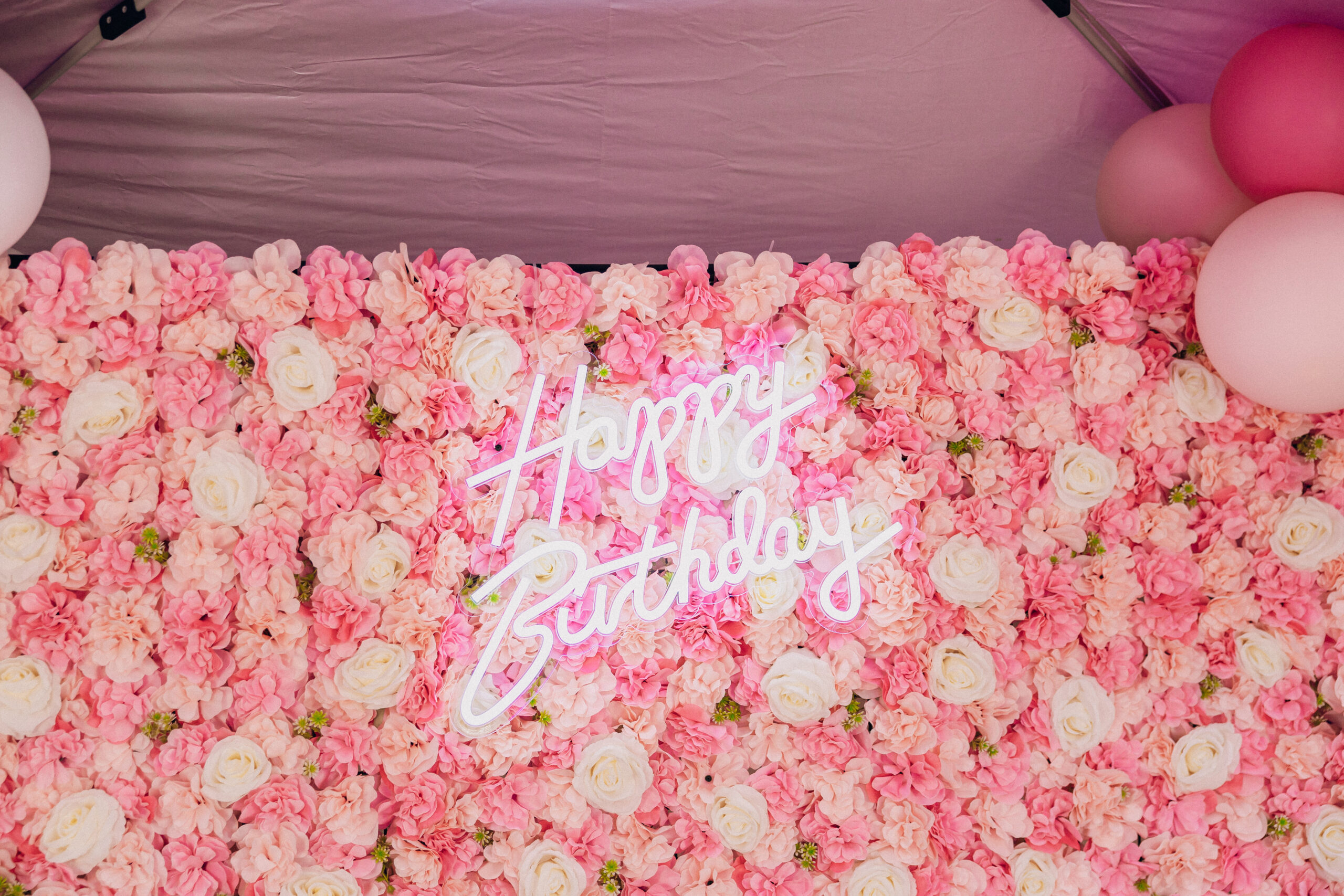 Floral Happy Birthday neon backdrop at a luxury 40th birthday party in Davie, Florida.