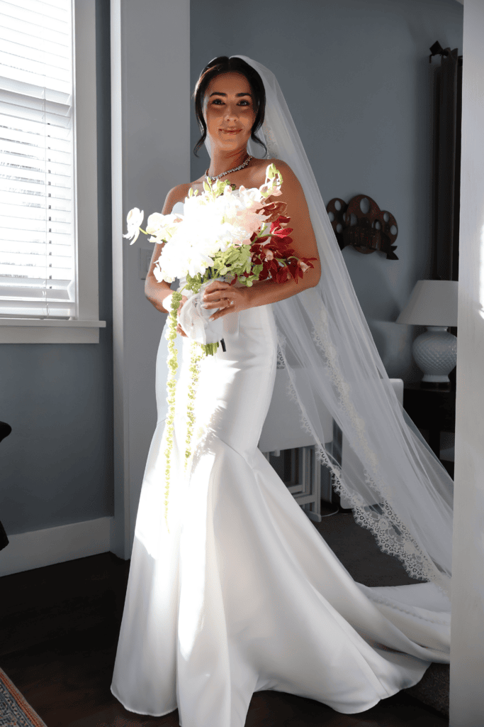 Bride posing in a naturally lit bridal suite at a Florida wedding venue before the ceremony.
