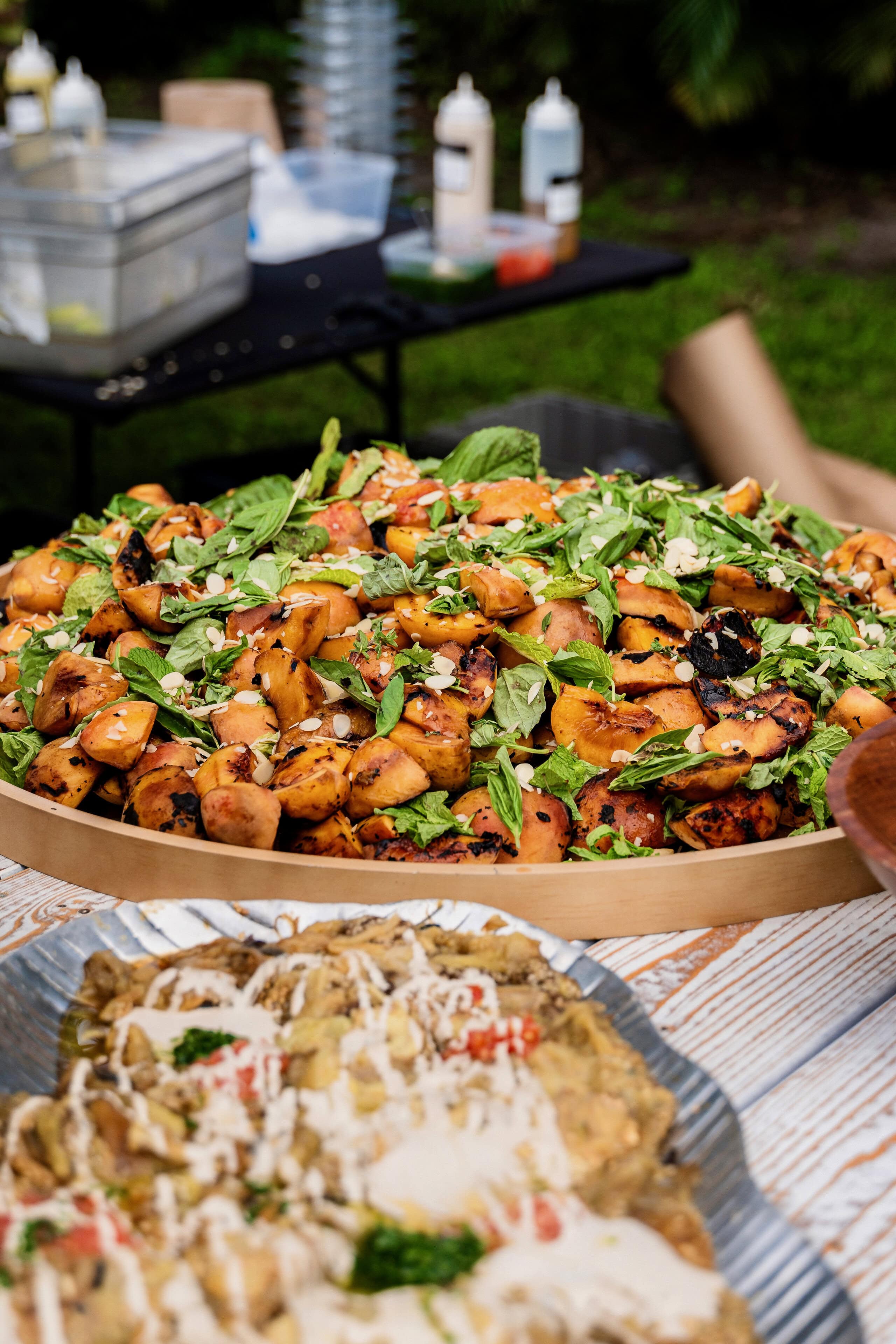 Gourmet grilled peach salad prepared for wedding catering