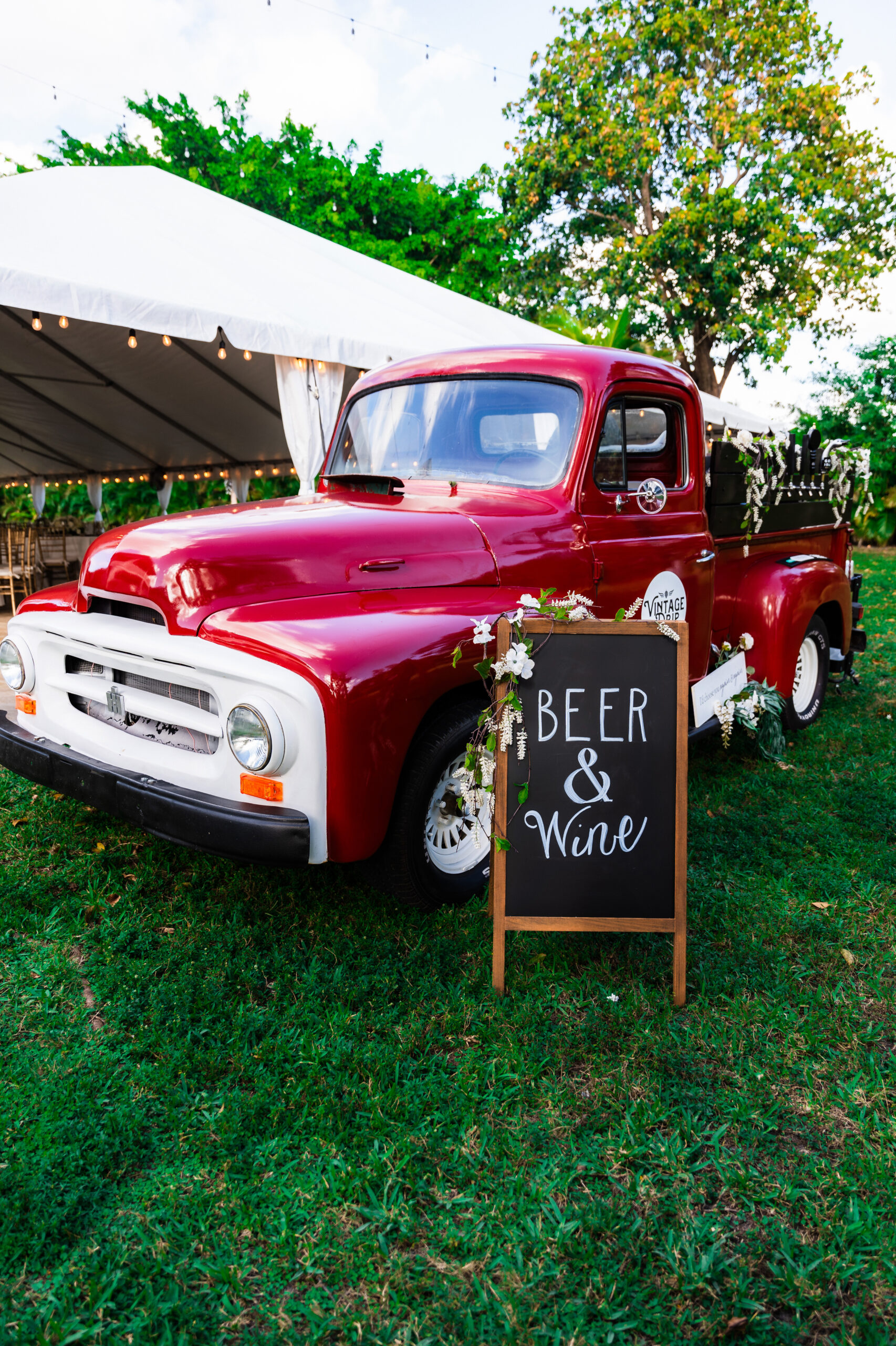 Vintage red truck beer and wine bar setup at Saint Patrick Palace outdoor wedding.
