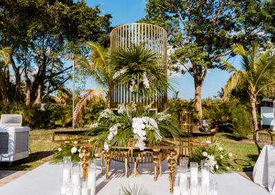 Gold sweetheart table with orchids and tropical greenery at Saint Patrick Palace