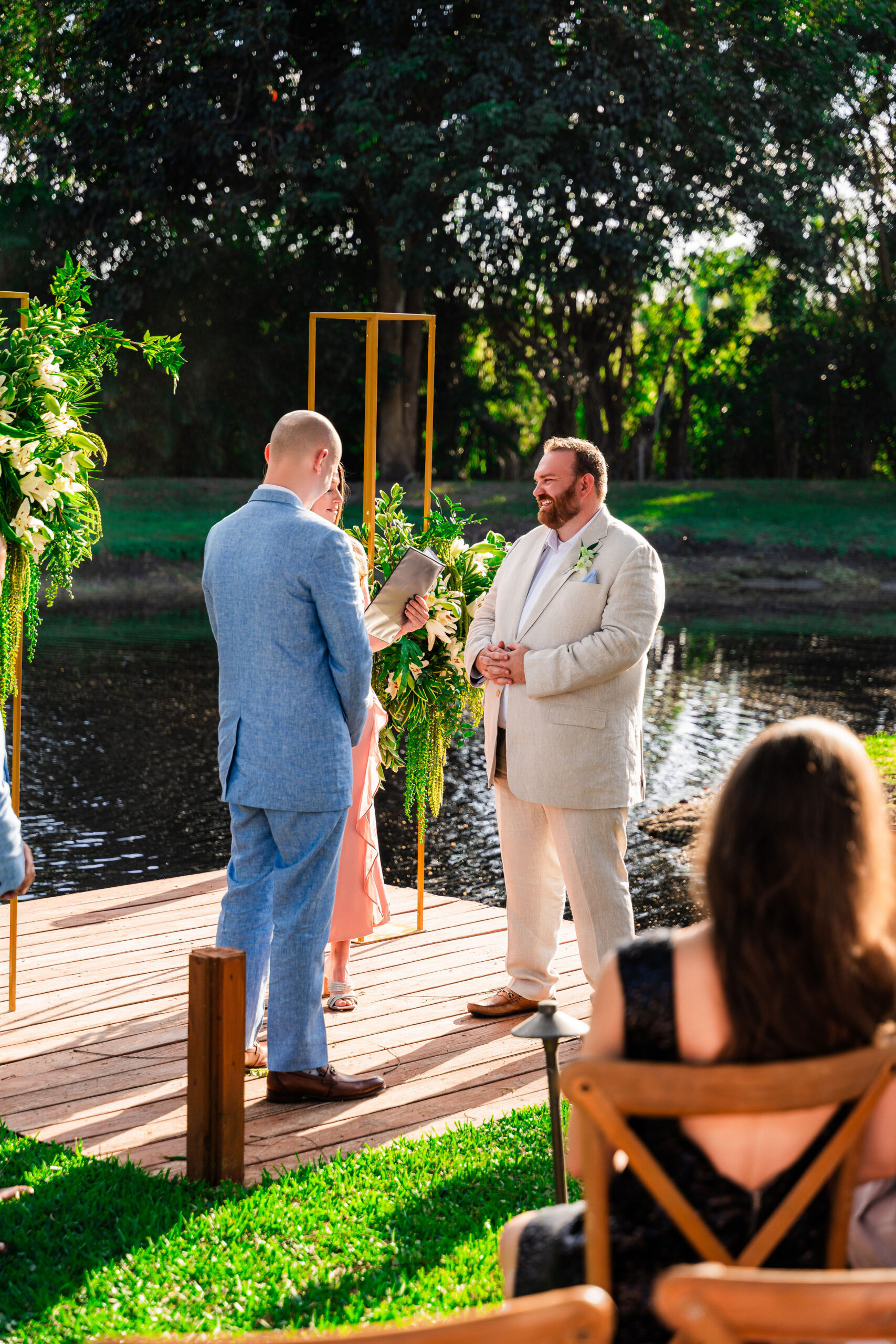 Lakeside wedding ceremony at Saint Patrick Palace featuring elegant design and seamless coordination by a full-service wedding planner.