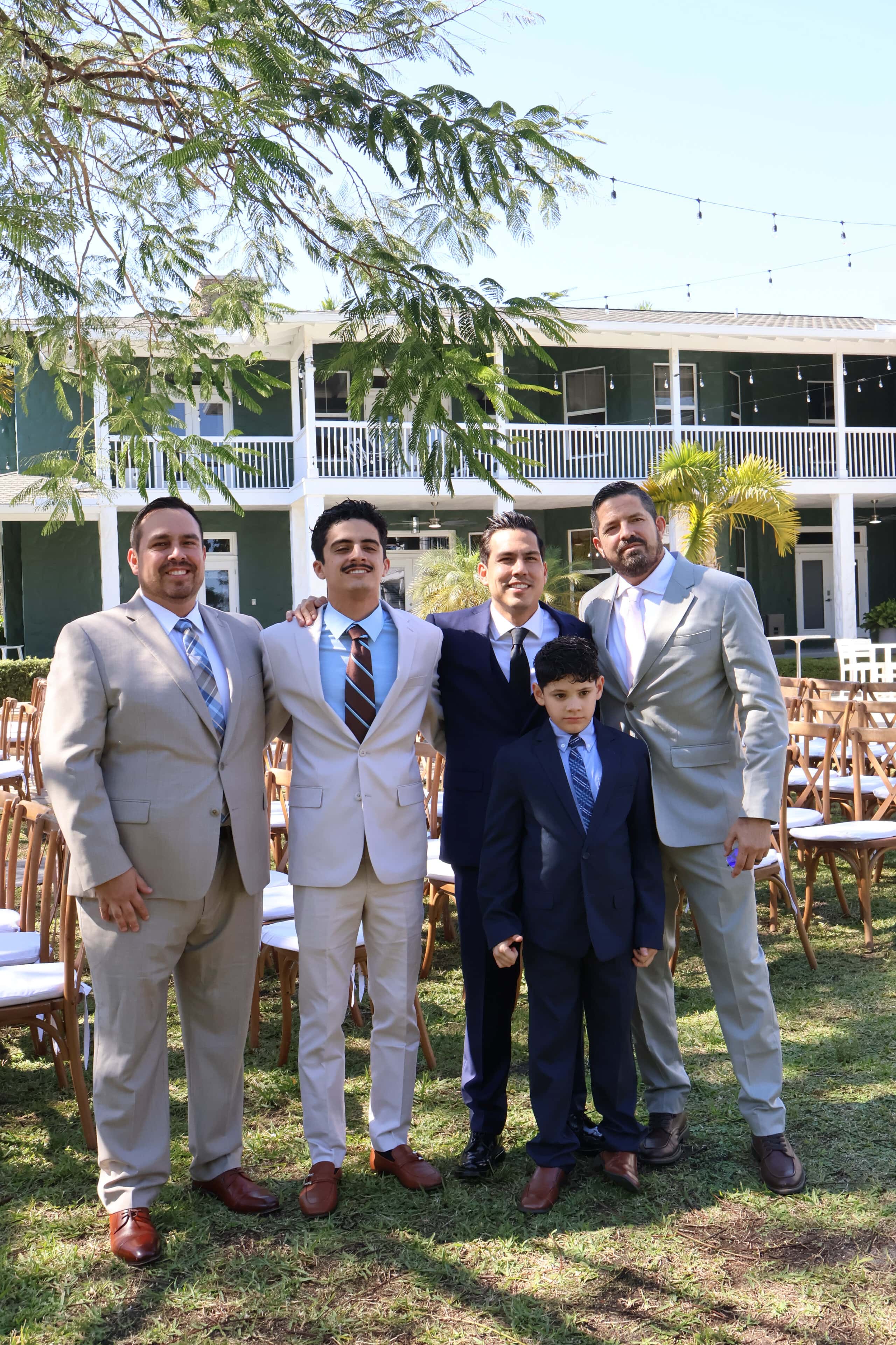 Groom with groomsmen posing outdoors before ceremony at Saint Patrick Palace