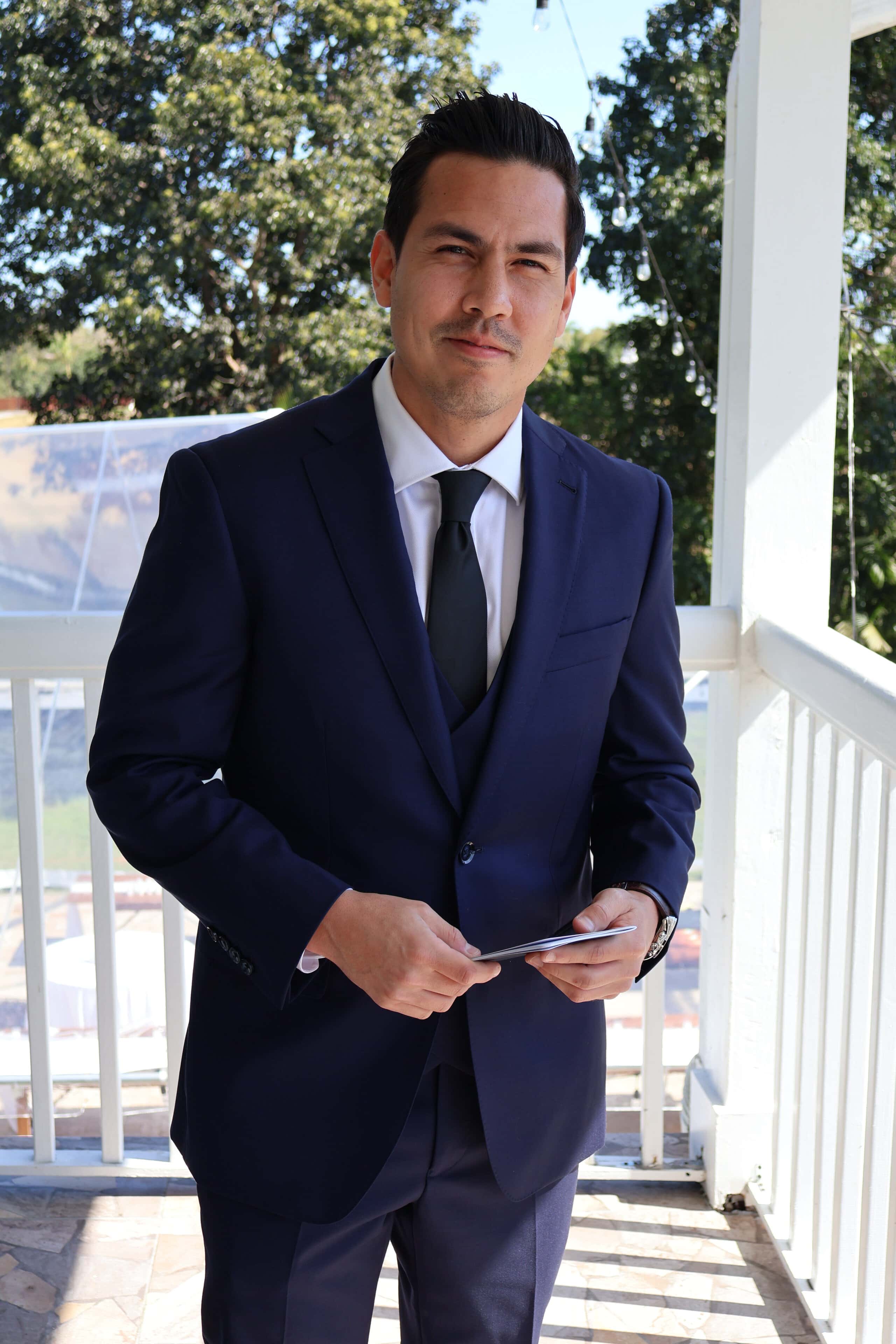 Groom portrait on veranda at Saint Patrick Palace wedding venue in Davie Florida