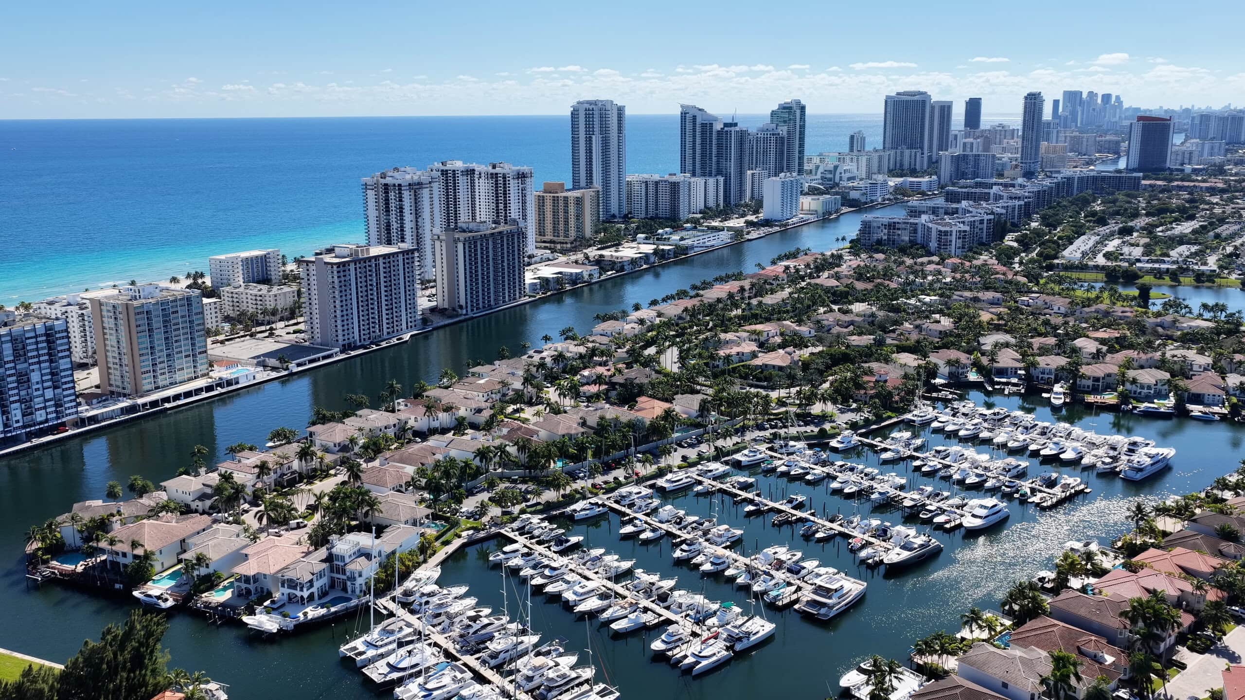 Hollywood, Florida marina, Intracoastal waterways, beachfront skyline, and Atlantic Ocean viewed from above.