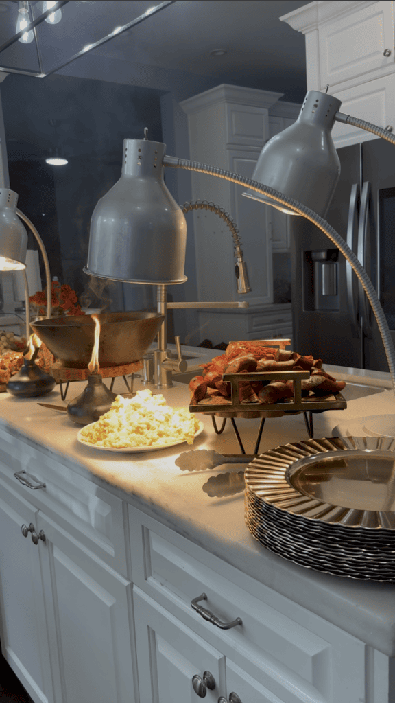 Hot wedding day brunch buffet with eggs and breakfast meats served from the kitchen at a private South Florida estate.